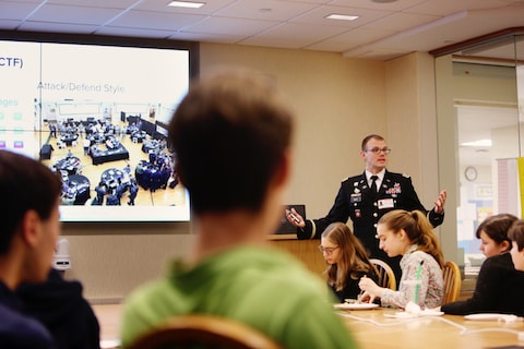 Outreach event at St. Lukes High School teaching them about the Cyber Team.